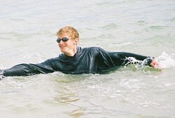 surf swimming in a hoodie